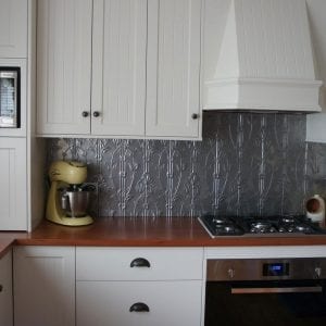 Pressed Tin Panels 'Lily' pattern powder coated in Mercury Silver and installed as a kitchen splashback