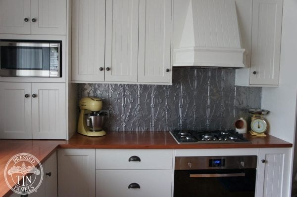 Pressed Tin Panels 'Lily' pattern powder coated in Mercury Silver and installed as a kitchen splashback