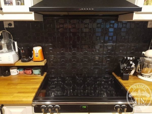 Pressed Tin Panels Evans pattern in black gloss powder coat installed as cooktop splashback